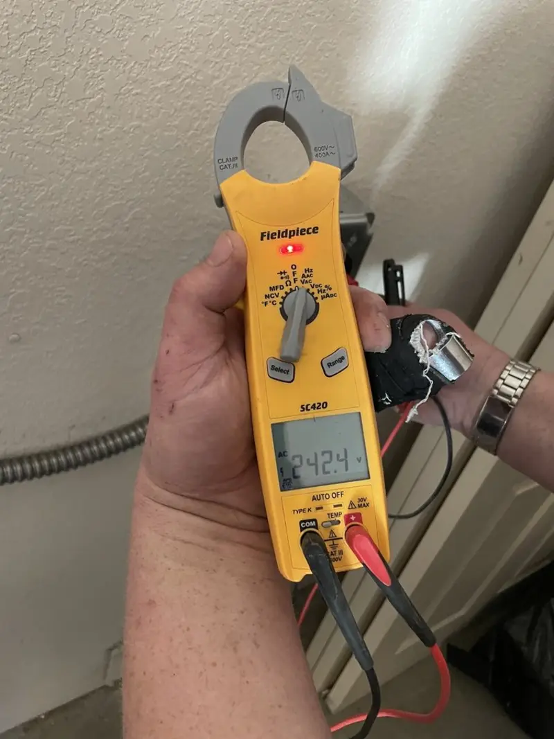 Voltage testing with clamp meter during Outlet Installation in Richmond Heights